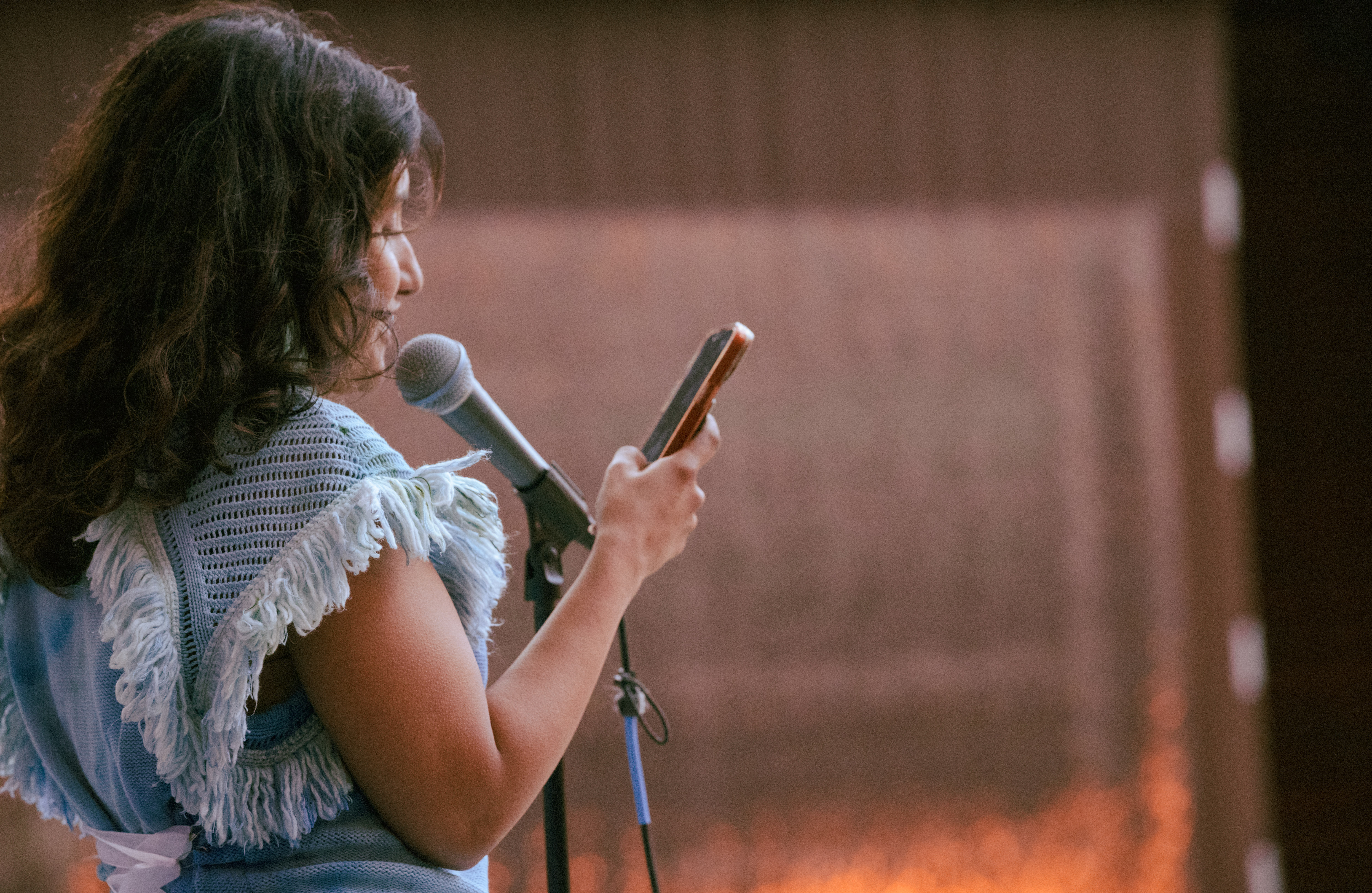 woman speaking into microphone